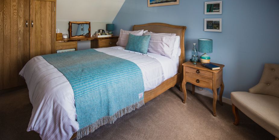 Glason Farm Guesthouse double bedroom with wardrobe and dressing table, blue and beige decor