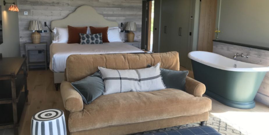 Uig Sands bedroom with superking bed, sofa and roll top bath.