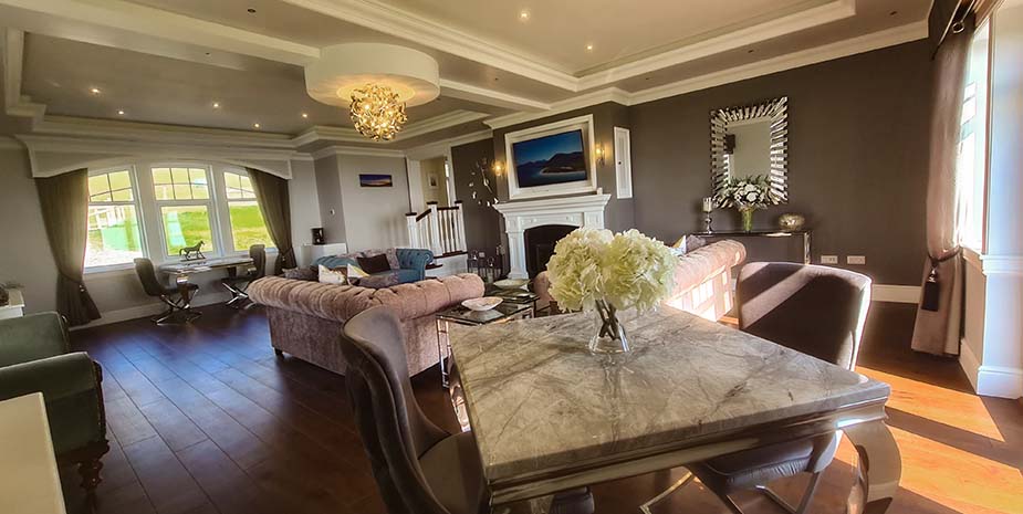 Inviting dining space in Sranndabhal B&B showcasing a marble table and elegant seating arrangements.